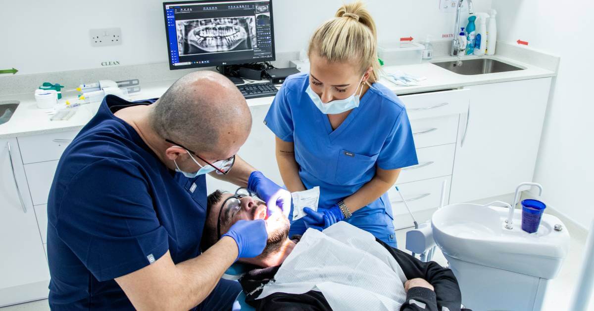 Dentist and Assistant During Appointments